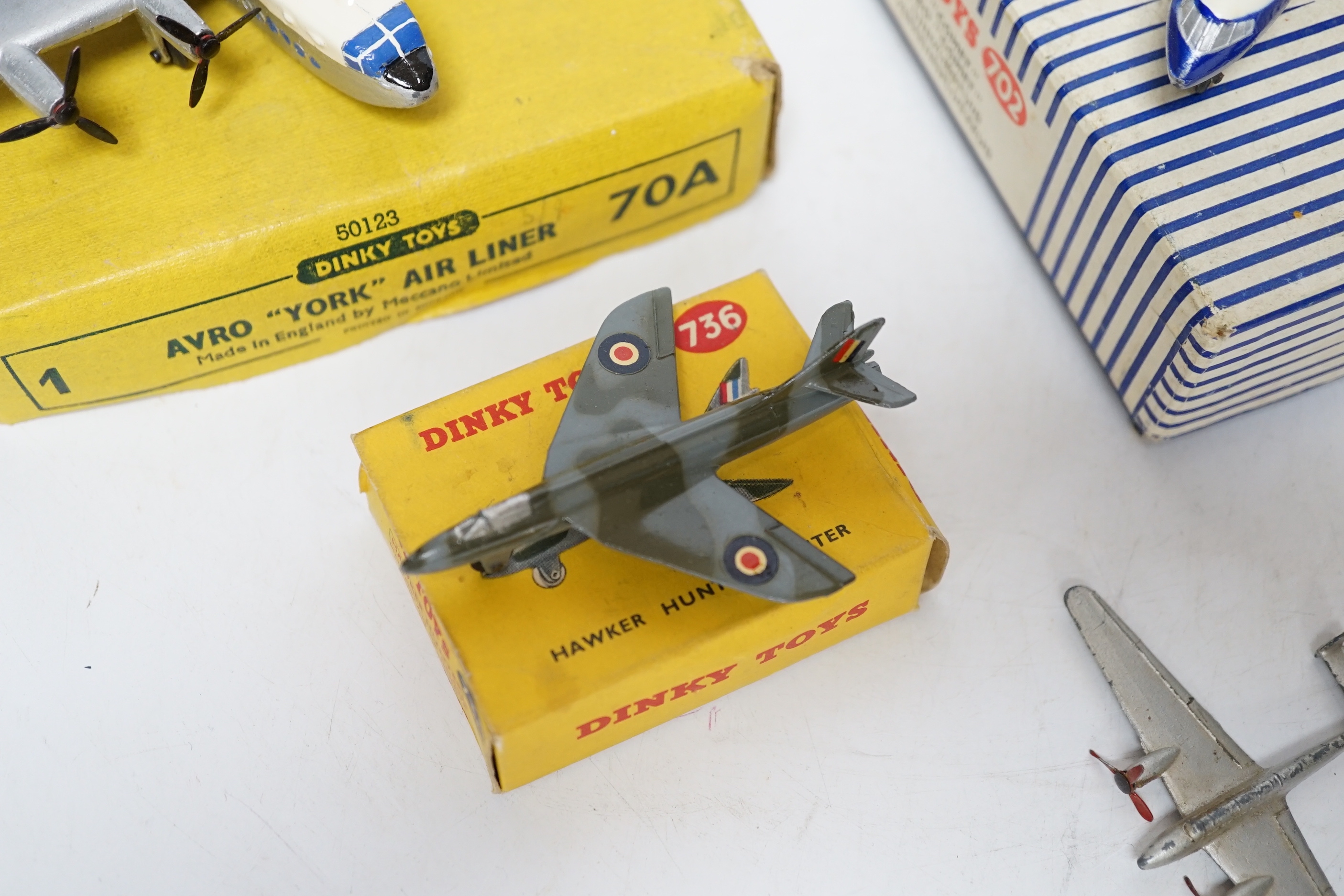 Four Dinky Toys aircraft; three boxed examples including (702) DH Comet Airliner, (70A) Avro York Airliner, (736) Hawker Hunter Fighter, and an unboxed Twin Engined Fighter